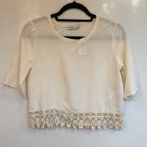 Cream crop top with crocheted bottom